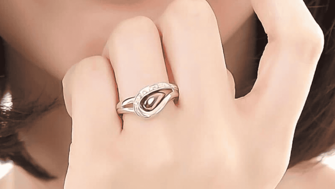 Platinum ring set with a purple gold “teardrop”