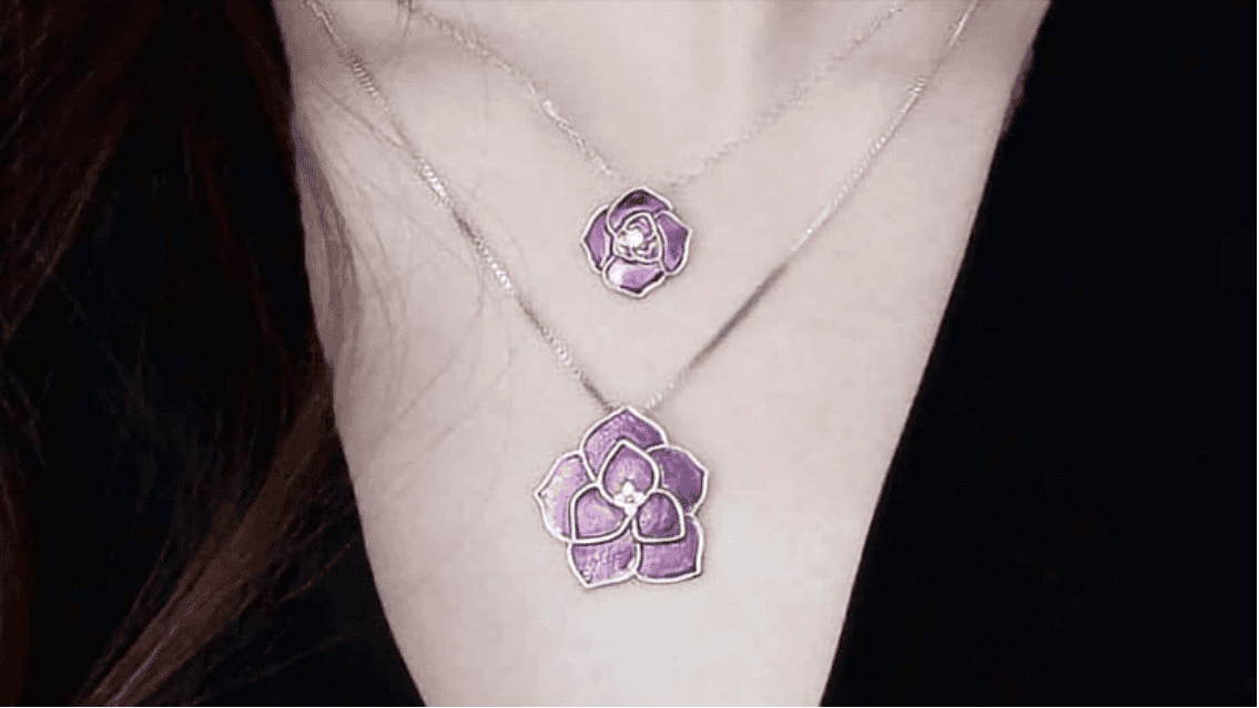 Two flower-shaped purple gold necklaces