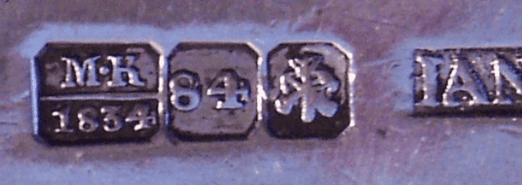 Two crossed anchors—one for the sea, one for the river—over a scepter hallmark.